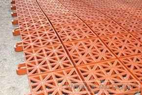 Plastic tile for laying tracks in the country